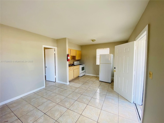 kitchen with tasteful backsplash, light tile patterned floors, light brown cabinetry, and white appliances