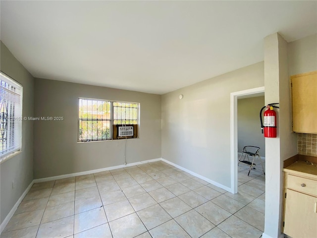 spare room featuring light tile patterned flooring