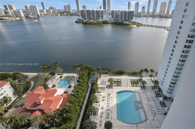 birds eye view of property with a view of city and a water view