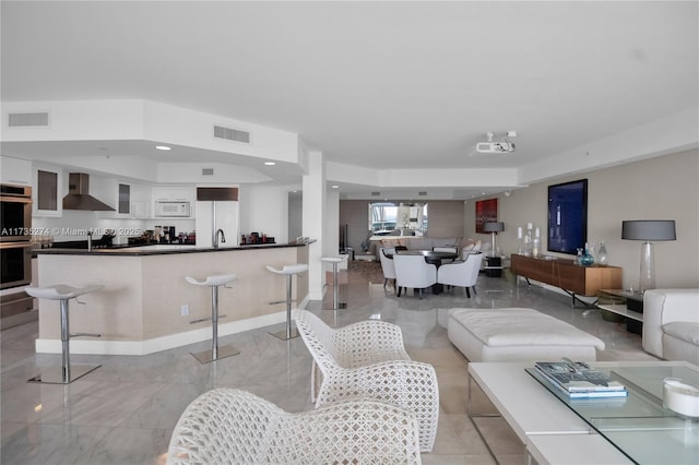 living room with recessed lighting and visible vents