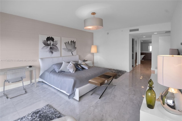 bedroom featuring visible vents and baseboards