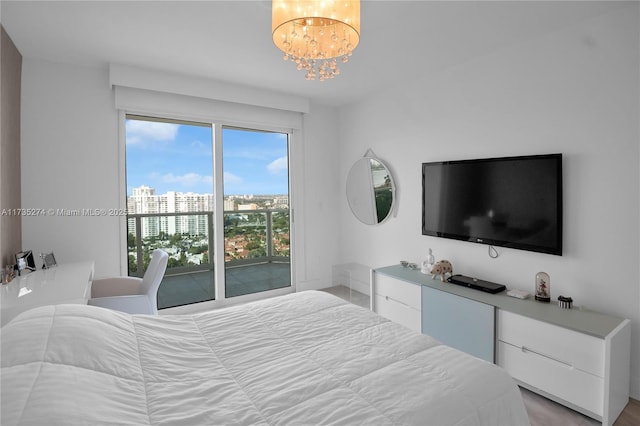 bedroom featuring an inviting chandelier