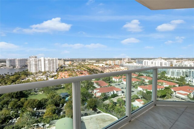 balcony with a city view and a water view