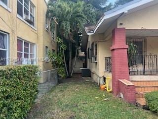 view of side of property featuring a yard