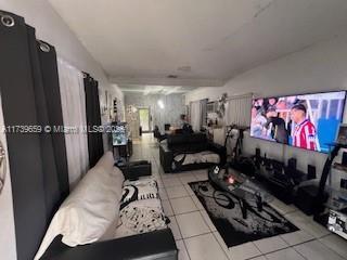 living room featuring light tile patterned floors