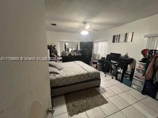 bedroom featuring light tile patterned floors and ceiling fan