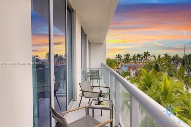 view of balcony at dusk