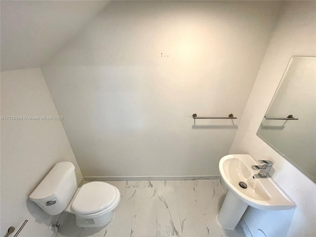 bathroom featuring toilet and sink