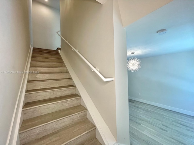 stairway featuring hardwood / wood-style flooring