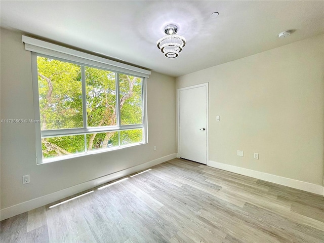 spare room with light wood-type flooring