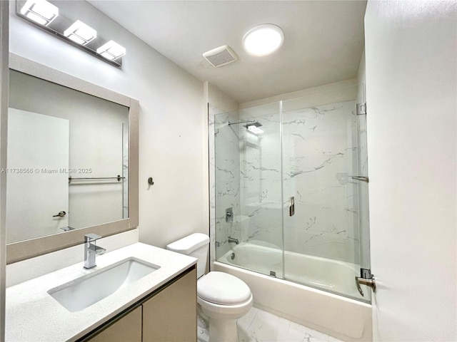 full bathroom with vanity, shower / bath combination with glass door, and toilet