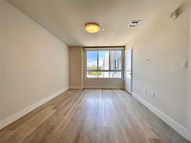 empty room featuring light hardwood / wood-style floors