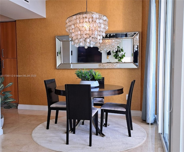 dining area featuring an inviting chandelier