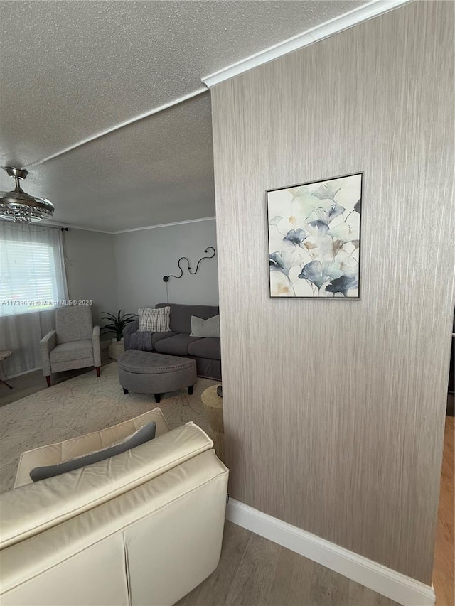 living room with hardwood / wood-style flooring and a textured ceiling