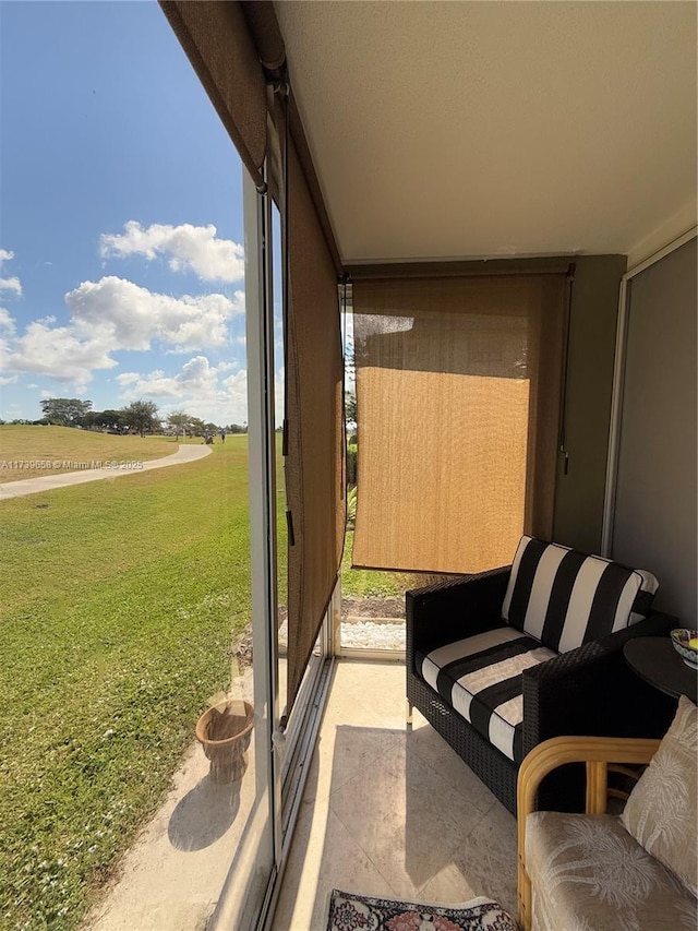 sunroom / solarium featuring a rural view