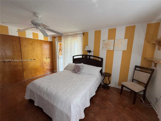 bedroom featuring dark hardwood / wood-style floors and ceiling fan