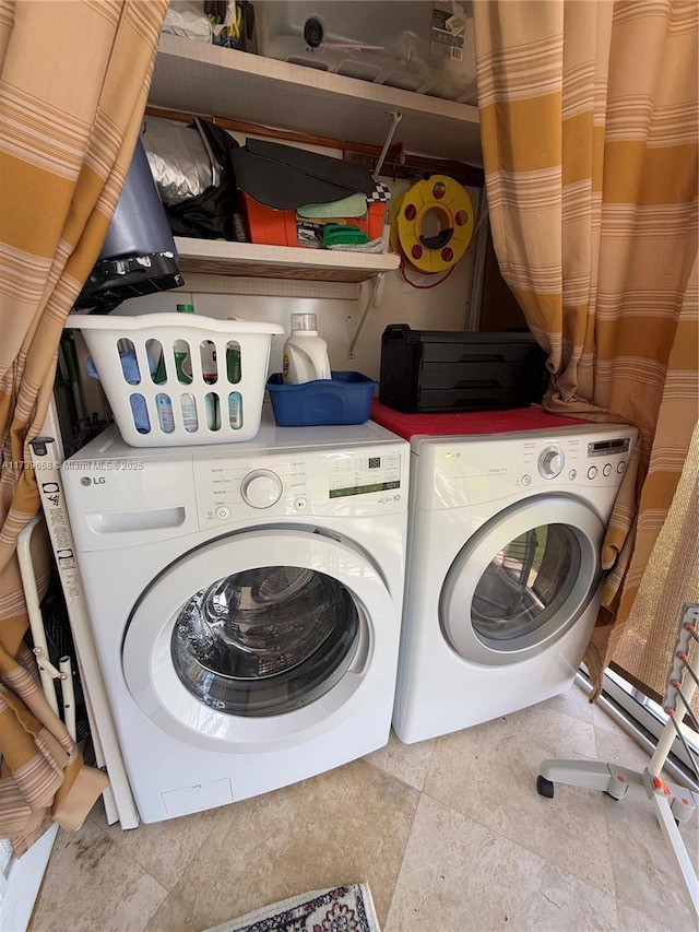 clothes washing area with washer and dryer