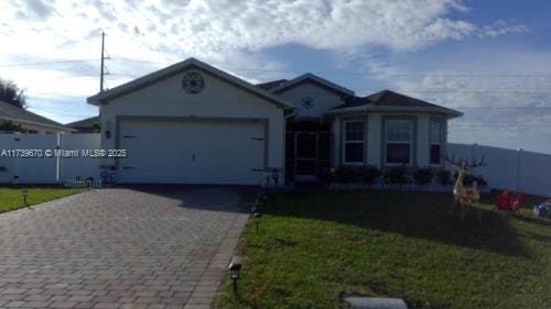 view of front of house with a garage and a front yard