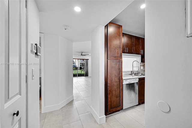 hallway with sink and light tile patterned floors