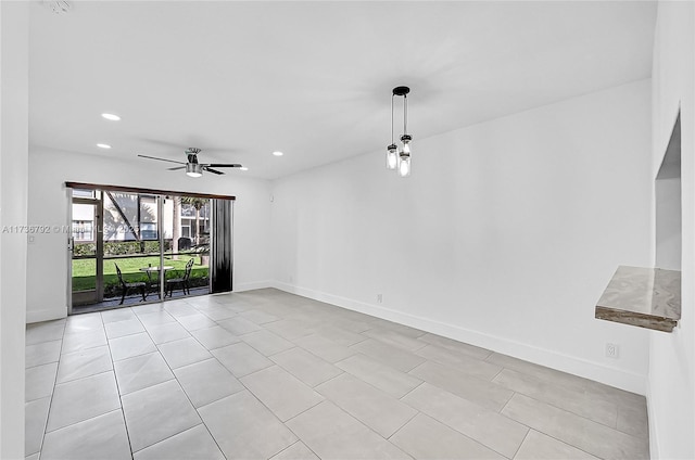 unfurnished living room with ceiling fan