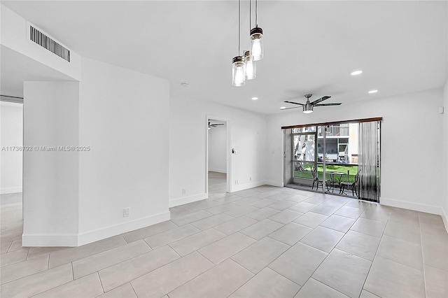 tiled empty room featuring ceiling fan