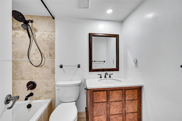 full bathroom featuring toilet, vanity, and bathtub / shower combination