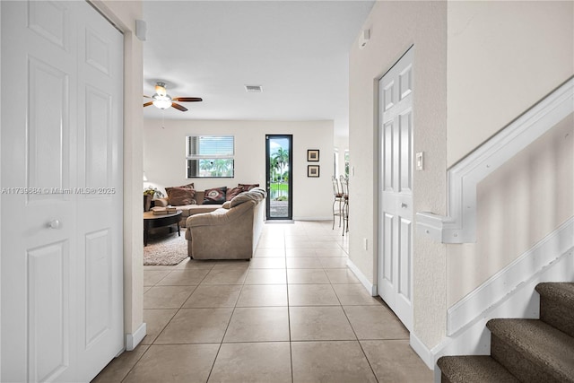 hall with light tile patterned flooring