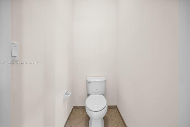 bathroom featuring tile patterned flooring and toilet