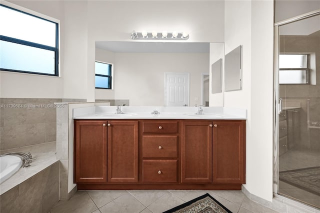 bathroom featuring vanity, tile patterned floors, and plus walk in shower