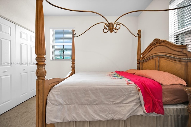 carpeted bedroom featuring a closet