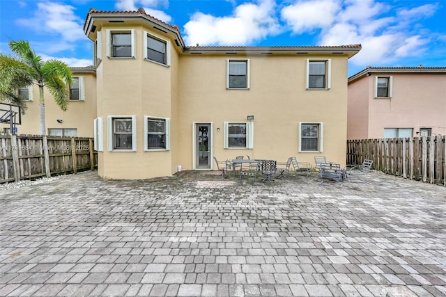 rear view of house featuring a patio area