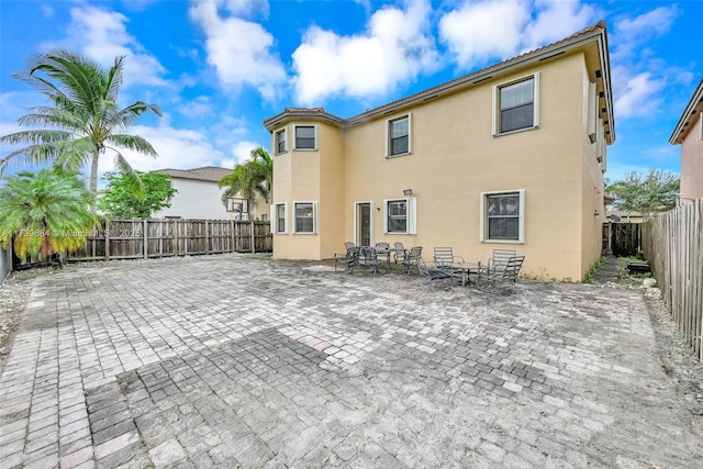 rear view of house featuring a patio