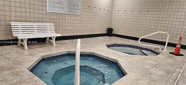 view of pool featuring a hot tub