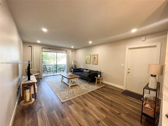 living room featuring dark hardwood / wood-style flooring