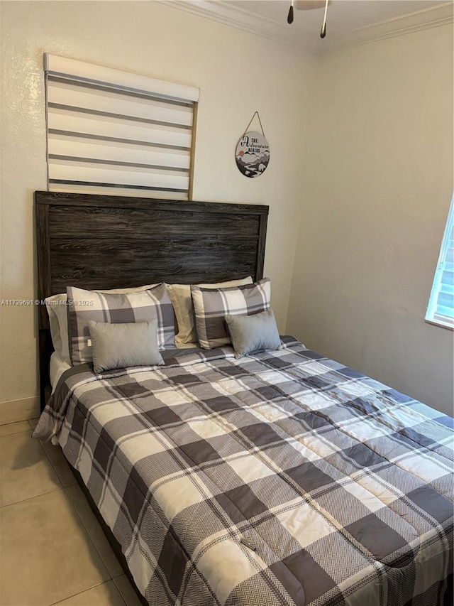 bedroom featuring crown molding and tile patterned flooring