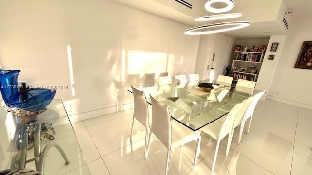 tiled dining space with baseboards