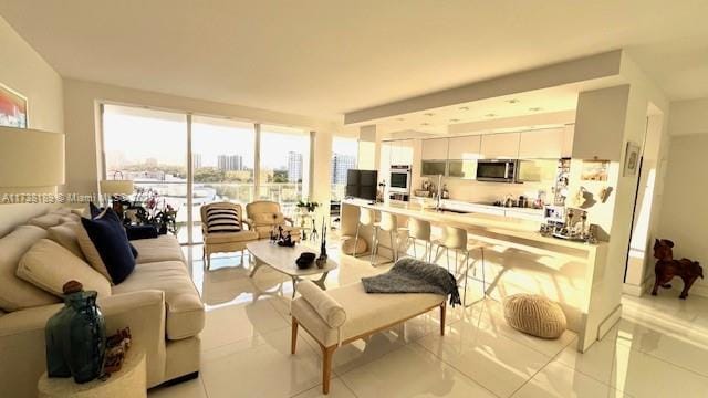 living area with light tile patterned floors