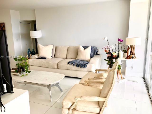 living room featuring tile patterned flooring