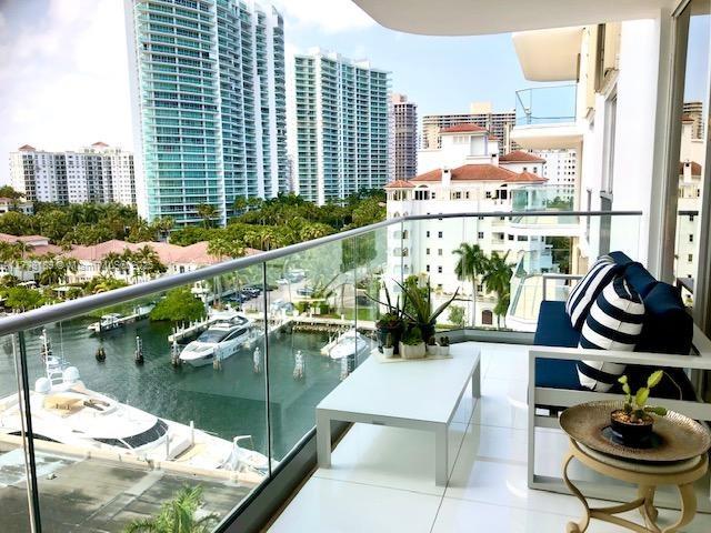 balcony with a view of city and a water view