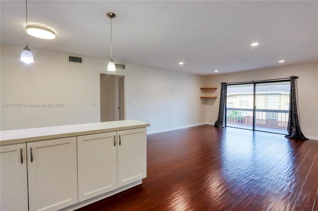 unfurnished room featuring dark hardwood / wood-style flooring