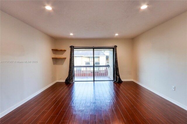 empty room featuring dark hardwood / wood-style floors