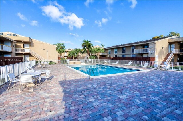 view of pool featuring a patio area