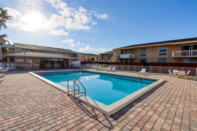 view of swimming pool with a patio