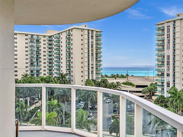 balcony featuring a water view