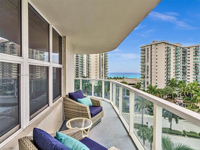 balcony featuring a water view