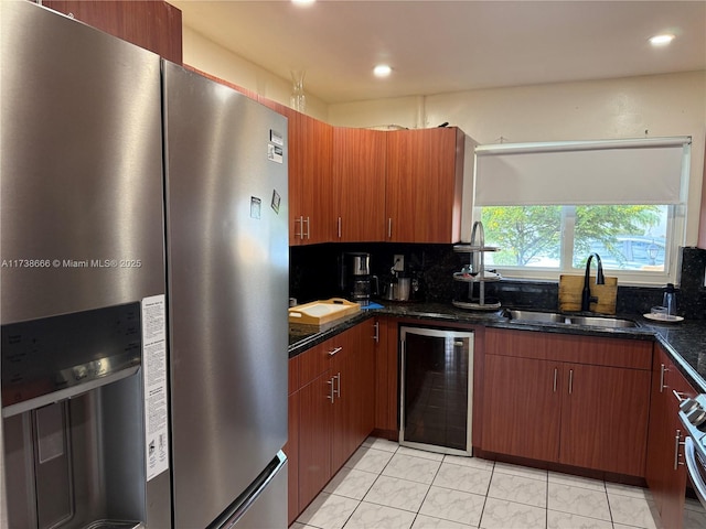 kitchen with wine cooler, sink, backsplash, and stainless steel fridge