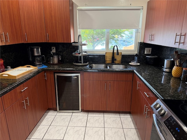 kitchen featuring dark stone countertops, sink, backsplash, and stainless steel electric stove