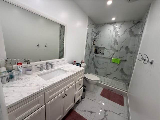 bathroom with vanity, toilet, and walk in shower