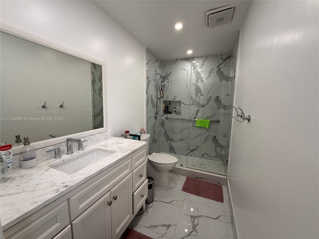 bathroom with vanity, toilet, and walk in shower