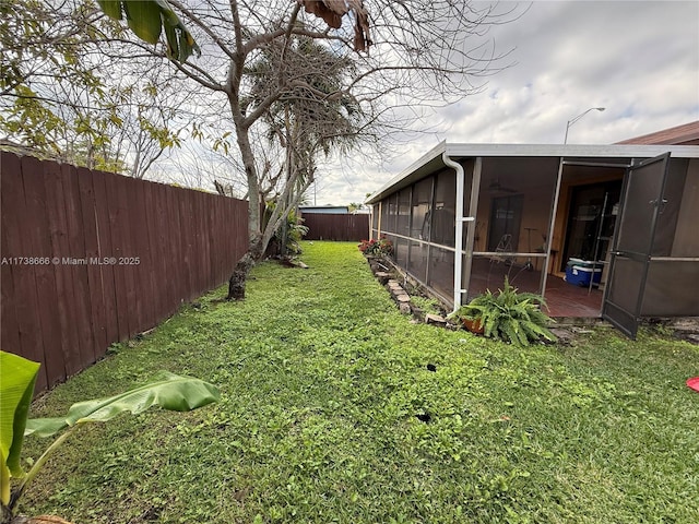 view of yard with a sunroom